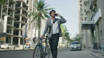 Smartphone, bicycle and city man, business agent or architect analysis, check or planning architecture building development. Cycling, digital blueprint or person on transport bike for travel commute video