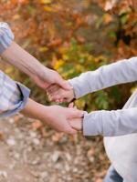 Mother and her daughter holding hands photo